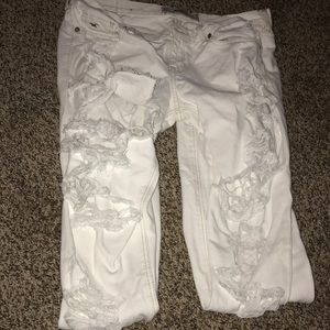 white pants with rips